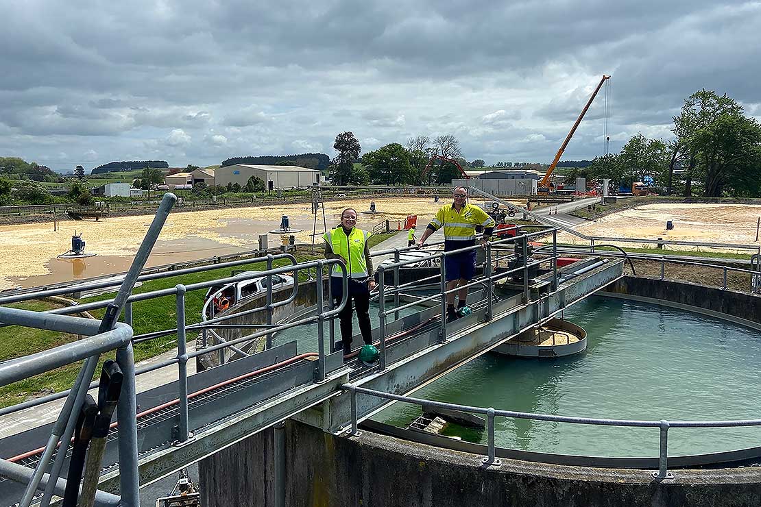 Caitlyn Poole and Graeme Jacobson on top of the clarifiers at Fonterra